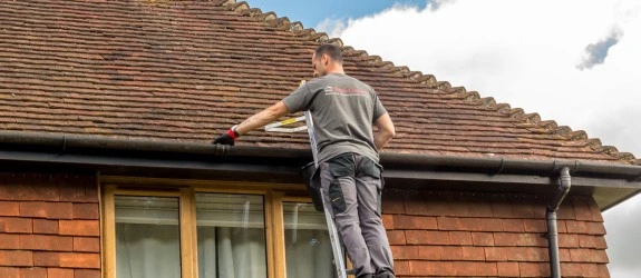Gutter cleaning a residential property in Faversham